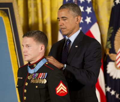 President Barack Obama awards the Medal of Honor to retired Marine Cpl. William “Kyle” Carpenter on Thursday. (Associated Press)
