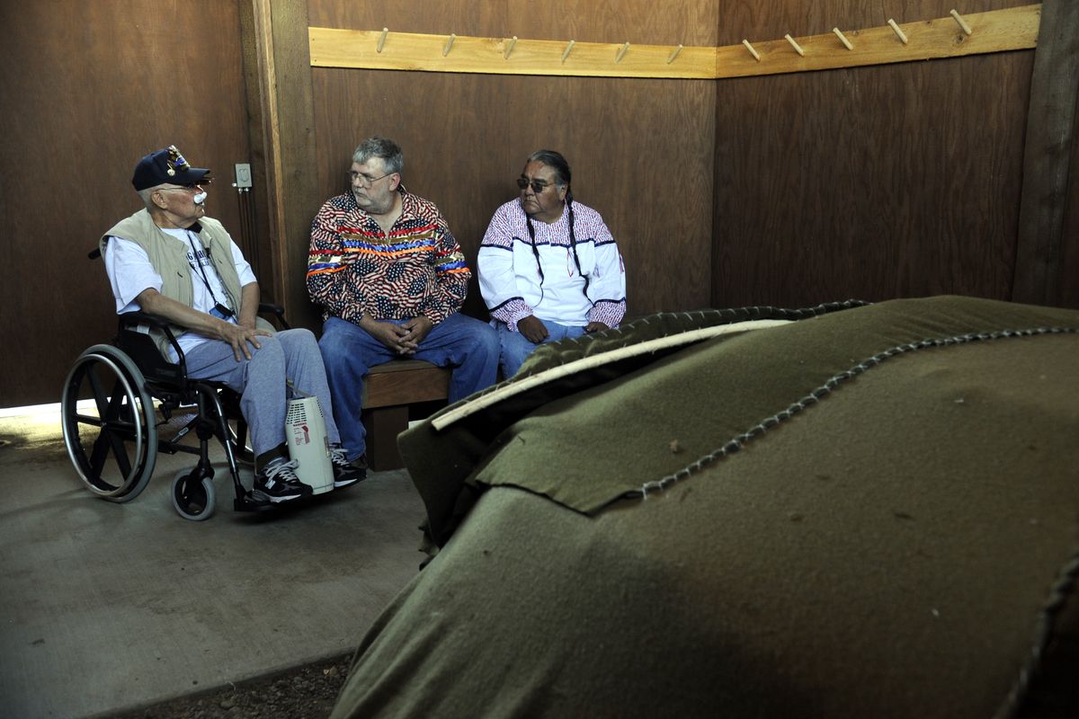 Glen Douglas, John Davis and Victor Lasarte sit inside a sweat lodge at the Spokane VA hospital Wednesday. (Jesse Tinsley / The Spokesman-Review)