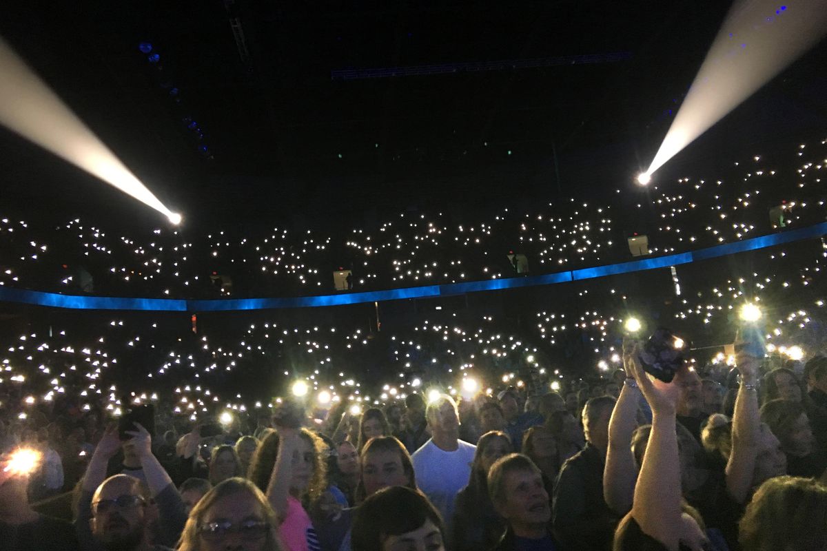 The crowd holds up their cellphones while Garth Brooks sings  at the afternoon show at the Spokane Arena. (Carolyn Lamberson / The Spokesman-Review)