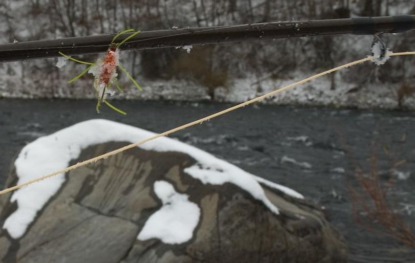 A fly fisherman's lure indicates the temperature was cold as he fished the Spokane River in November. (Dustin Bise)