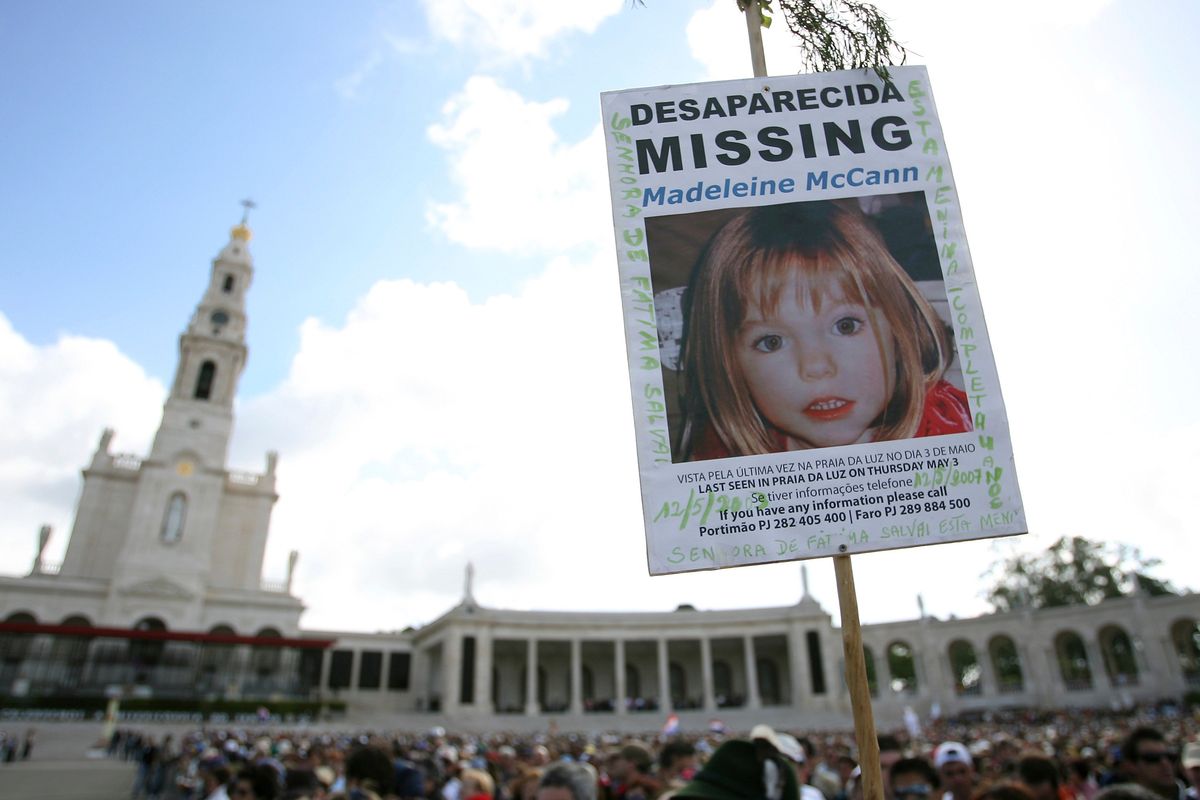 FILE – A picture of missing British girl Madeleine McCann, who disapeared from the Praia da Luz beach resort in the Algarve, is displayed at Our Lady of Fatima shrine Sunday, May 13 2007, in Fatima, northern Portugal. The parents of Madeleine McCann, a British toddler who vanished from an apartment during her family’s vacation in Portugal 15 years ago and captured global interest, say they remain hopeful that efforts by police in three countries to solve the mystery will eventually bring answers. Kate and Gerry McCann, both British doctors living in England, said in a statement to mark the anniversary of their daughter’s disappearance Tuesday, May 3, 2022 that “a truly horrific crime” was committed in 2007.  (Steven Governo)