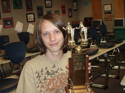 
James Ganas holds a Central Valley debate team trophy. Photo by Rainey Coffin
 (Photo by Rainey Coffin / The Spokesman-Review)