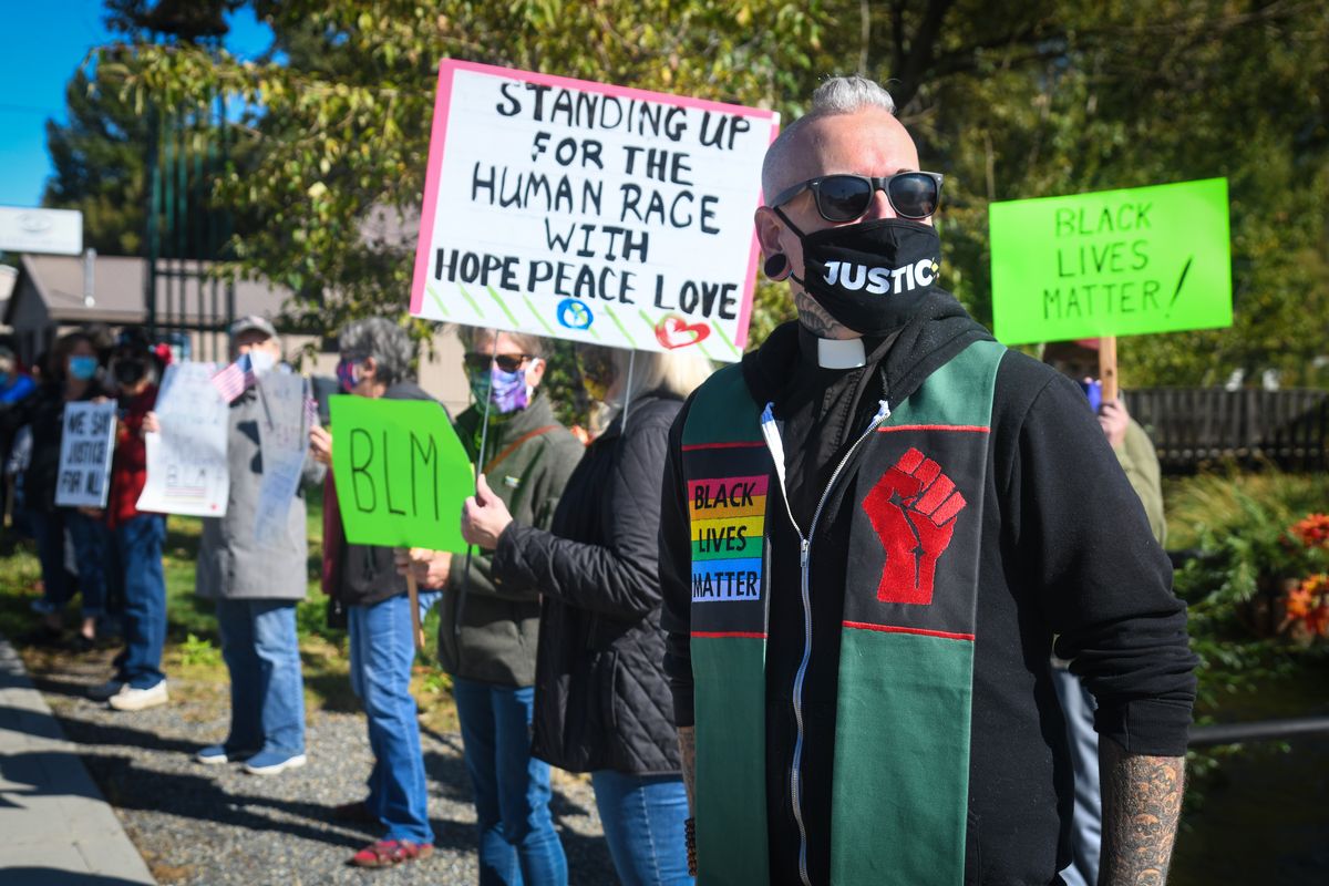 Pastor Jess Peacock, of the Chewelah United Church of Christ, wears his BLM stole during a Black Lives Matter vigil, Saturday, Sept. 26, 2020, on the corner of Park and Webster in Chewelah.  (DAN PELLE/THE SPOKESMAN-REVIEW)