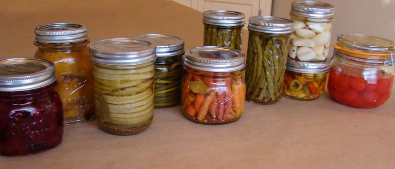 From left to right: cranberries, seckle pears, green tomato slices, garlic scapes, carrots, asparagus, dilly beans, garlic, hot peppers, and cherry tomatoes. (Maggie Bullock)