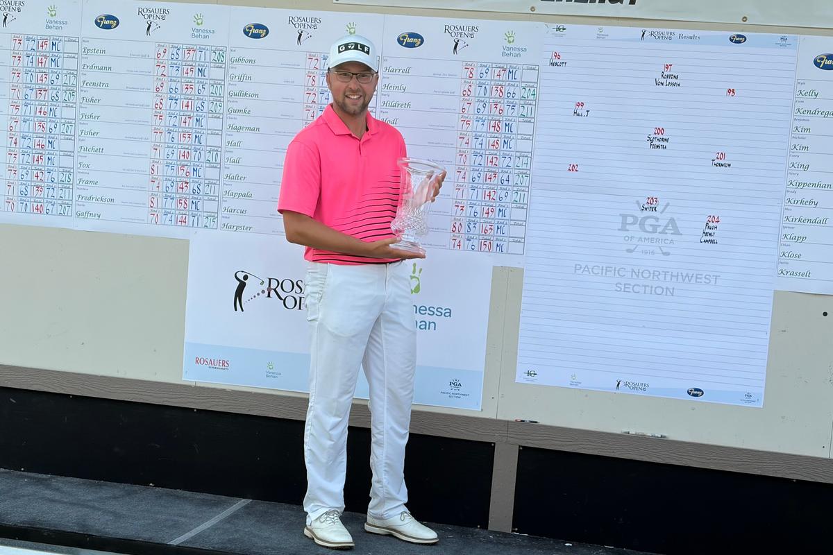 Hunter Wescott holds the trophy after winning the Rosauers Open on Sunday at Indian Canyon GC.  (Jim Meehan/The Spokesman-Review)