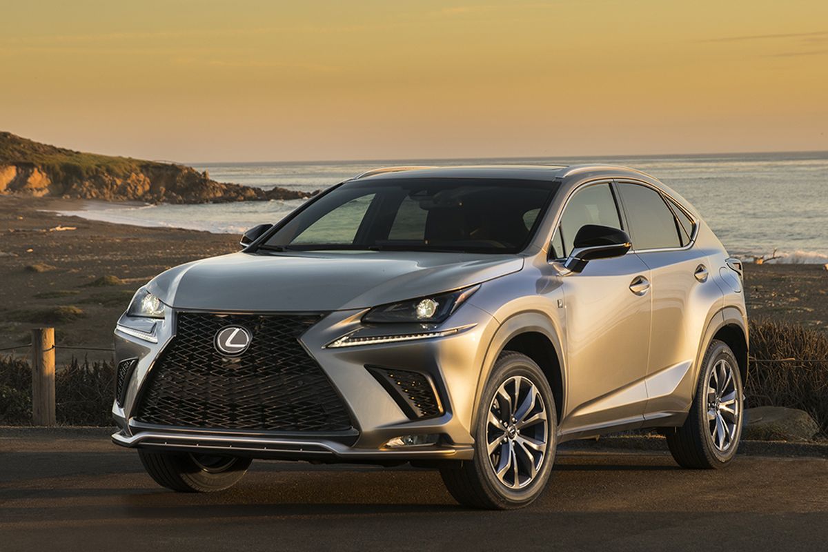 For 2018, the grille retains its hourglass profile but the Lexus logo now floats on a mesh insert. The grille anchors a protuberant and multi-faceted front fascia that includes a sweep of headlights, a swoop of LED driving lights and an outsized air dam packed with assorted planes, curves and folds. (Lexus)