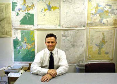 
Mark Richard sits in front of zoning and planning maps of Spokane County in the Spokane Home Builders Association office where he works. Richard is a Republican candidate for Spokane County commissioner. 
 (Holly Pickett / The Spokesman-Review)