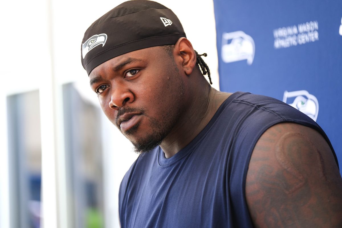 Jarran Reed meets with reporters after a July practice in Renton, Wash.  (Dean Rutz/Seattle Times)