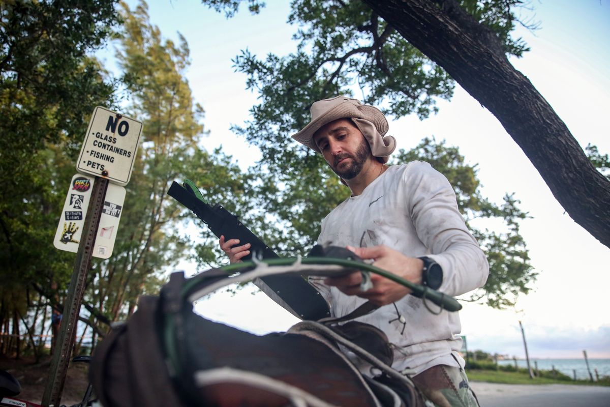 Andrew Otazo usually goes into the mangroves alone, both to protect the trees from foot traffic, and because “I really wouldn’t want anybody I like to do this. It’s hard, and a little crazy.” (Reshma Kirpalani/The Washington Post)
