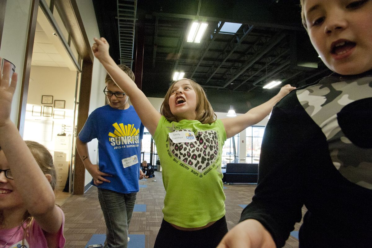 Emily Buechler roars with delight as she watches as her team’s raw egg survive a toy-car ride down a short ramp Thursday at the STEM camp for fourth-graders at Spokane Valley Tech. The other students are, from left, Jerrisa Barnes, Mitchell Burch and Isaac Morris. (Dan Pelle)