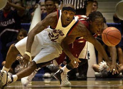 
Gonzaga guard Erroll Knight and Winthrop guard Torrell Martin chase a second-half loose ball at an opening round game in the NCAA Tournament in Tuscon, Ariz. 
 (Brian Plonka / The Spokesman-Review)