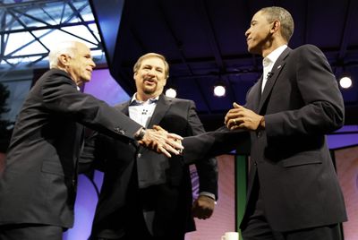 Sen. Barack Obama, D-Ill., right, shakes hands with Sen. John McCain, R-Ariz.,  as Pastor Rick Warren looks on, during the Saddleback Forum in Lake Forest, Calif., on Saturday.  (Associated Press / The Spokesman-Review)