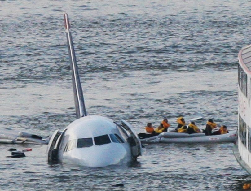 ORG XMIT: NYDP103  Passengers in an inflatable raft move away from an Airbus 320 US Airways aircraft that has gone down in the Hudson River in New York, Thursday Jan. 15, 2009. It was not immediately clear if there were injuries. (AP Photo/Bebeto Matthews) (Bebeto Matthews / The Spokesman-Review)