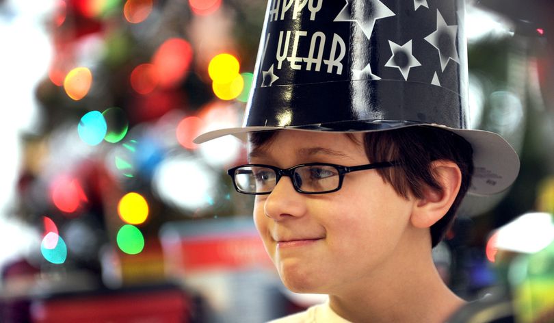 Jon Cody, 10, of Coeur d'Alene donned a party hat during the Specialized Needs Recreation Camp All-Stars pre New Years Eve celebration on Thursday, December 29, 2011. Specialized Needs Recreation is a non-profit organization that provides recreational opportunities for youth and adults who have developmental disabilities. (Kathy Plonka)