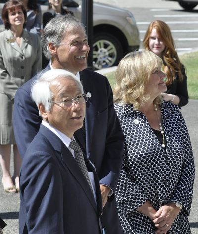 Gov. Jay Inslee and his wife, Trudi, watch as Hyogo Gov. Toshizo Ido addresses a crowd gathered for ceremonies to honor the sister-state relationship. (Jim Camden)