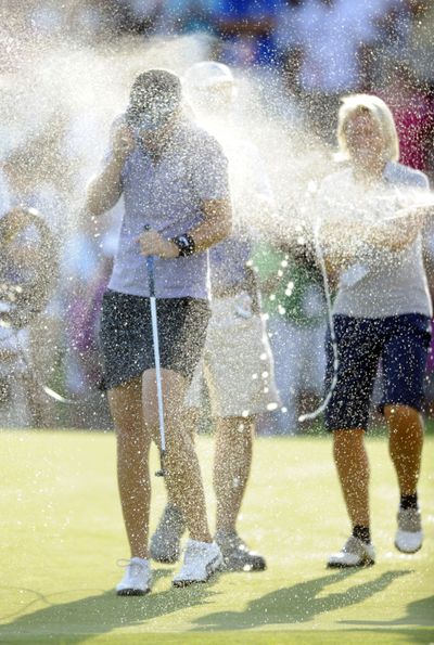 Anna Nordqvist is sprayed with champagne after her LPGA Championship victory. (Associated Press / The Spokesman-Review)