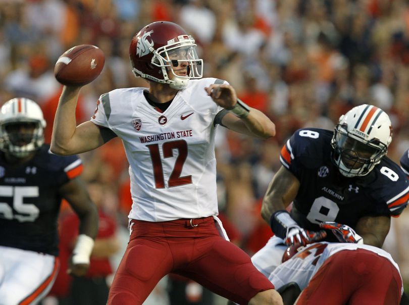 Washington State quarterback Connor Halliday completed 35 of 65 passes for 344 yards but threw three costly interceptions that helped Auburn’s cause. (Associated Press)