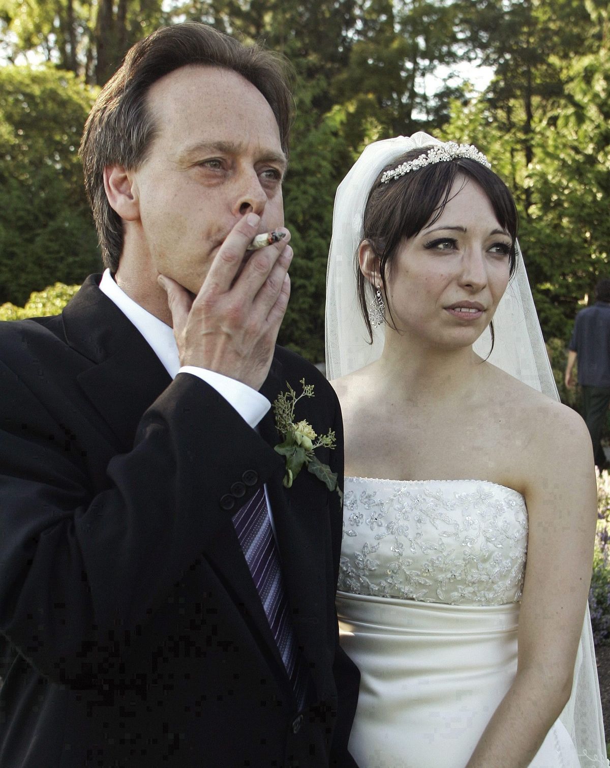 Marc Emery, Canada’s so-called Prince of Pot, smokes a marijuana cigarette at his marriage to his wife, Jodie, in Vancouver, B.C., on July 23, 2006.  (Associated Press / The Spokesman-Review)