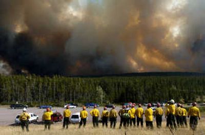 
Firefighters watch the Skyland fire Monday near U.S. Highway 2 at Marias Pass near East Glacier. Associated Press
 (Associated Press / The Spokesman-Review)