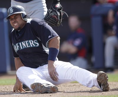 Seattle catcher Miguel Olivo suffered a strained adductor muscle on Saturday. (Associated Press)