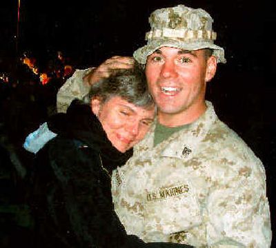 
Marine Cpl. Andrew DeLateur receives a tearful hug from his mother, Mary DeLateur of Spokane, at their reunion Sunday at Camp Pendleton in California, upon his return from his third tour of duty in Iraq. 
 (Courtesy of Tony DeLateur / The Spokesman-Review)