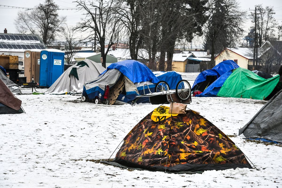 Many tents cover the ground in a homeless camp at the corner of 2nd Avenue and Ray Street, Friday, Feb. 5, 2022 in Spokane.  (DAN PELLE/THE SPOKESMAN-REVIEW)