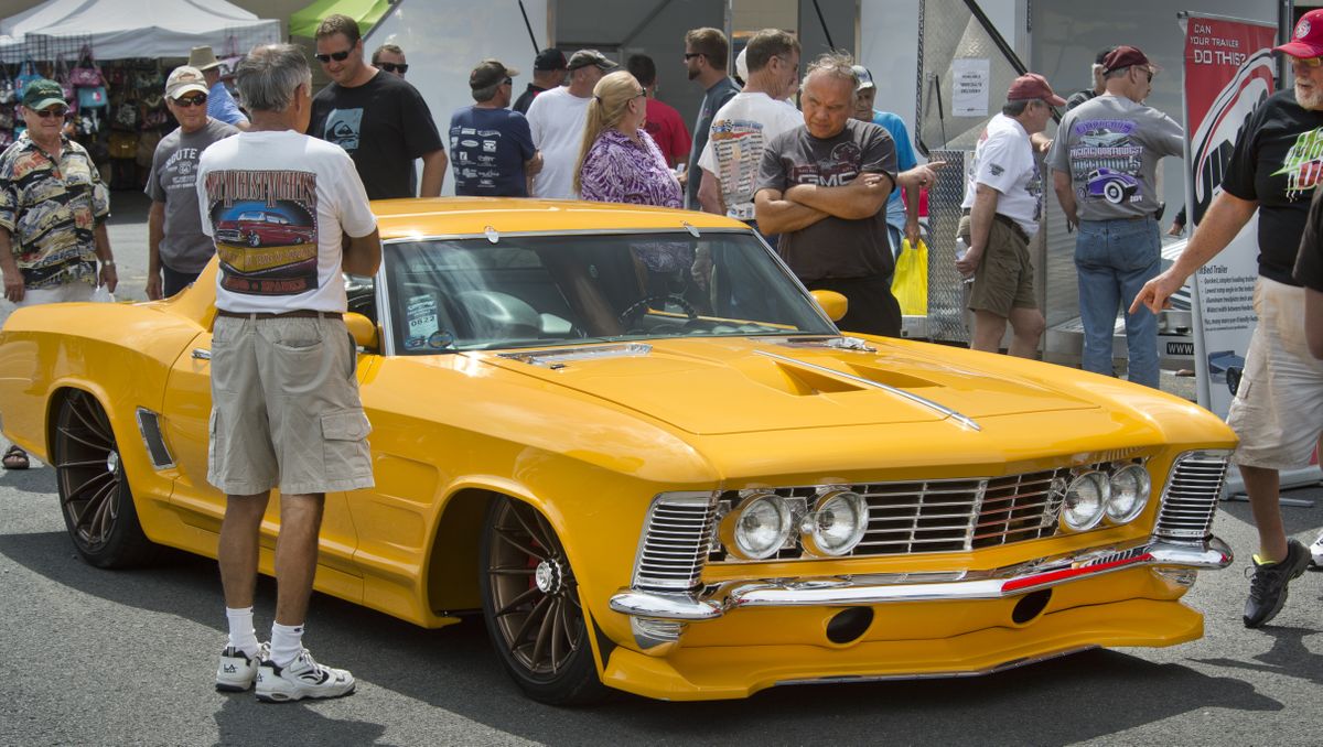 Car enthusiasts admire J.F. Launier’s customized 1964 Buick Riviera on Saturday at the Goodguys 13th Great Northwest Nationals at the Spokane County Fair & Expo Center. (Dan Pelle)