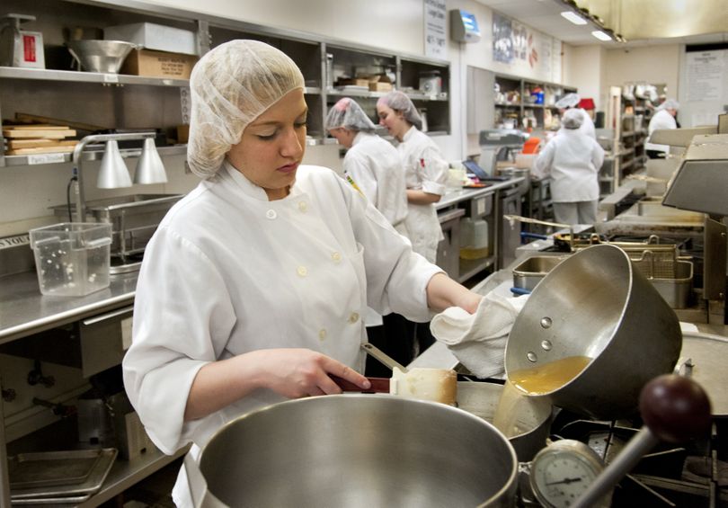 Liberty High School student Kylee Hodgson makes potato soup in the culinary arts class at the NEWTECH Skills Center. She has attended class there for the past two years. (Dan Pelle)