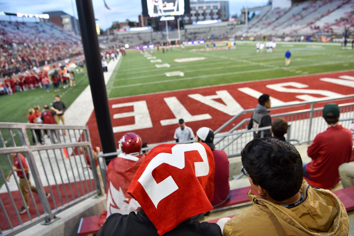 WSU sophomore Brandon Harbo wears a Tyler Hilinski "3" towel on his head with friend Leo Orozco, right, before the start of a college football game on Saturday, September 8, 2018, at Martin Stadium in Pullman, Wash. (Tyler Tjomsland / The Spokesman-Review)