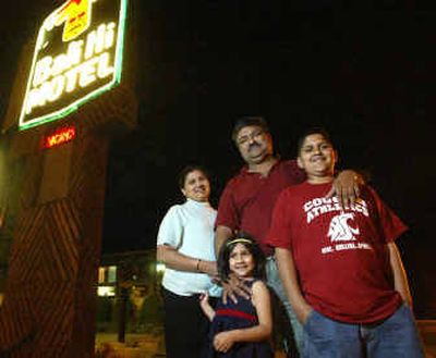 
Hemant Mistry, center, seen with his wife, Gita; son, Kunal, 11, and daughter, Shivani, 5, hopes his Richland motel, Bali Hi, and other independent Tri-Cities motels can stay afloat amid a possible price war among major hotel chains. 
 (Associated Press / The Spokesman-Review)