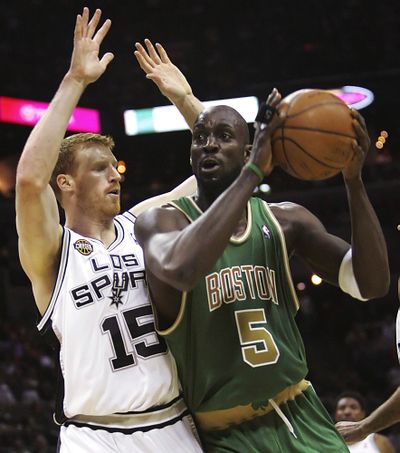 Celtics’ Kevin Garnett, right, returned to action after a month off.  (Associated Press / The Spokesman-Review)