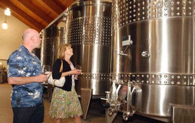 
Mike English, left, and Val Miller from Stillwater, Minnesota, check out the vats at the Domaine Drouhin winery in Dayton, Ore. Oregon's pinot noirs have gained an international reputation and a following of wine tourists. 
 (Associated Press Photos / The Spokesman-Review)