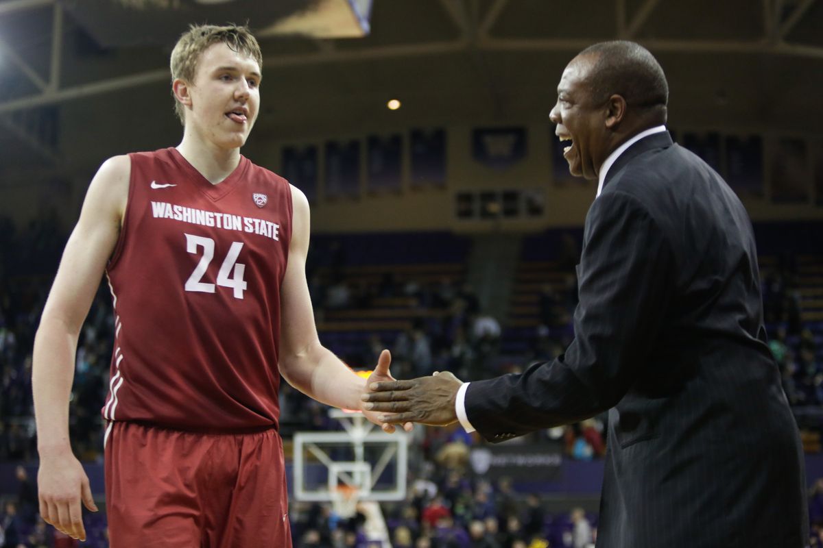 Washington State coach Ernie Kent, right, and forward Josh Hawkinson are all smiles after beating the Washington Huskies in Seattle recently. (Associated Press)