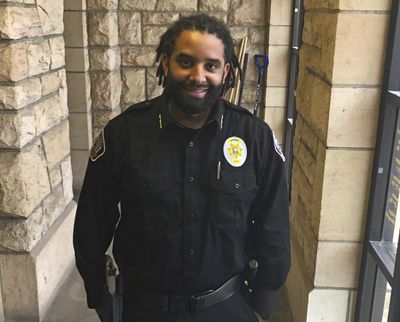 Albany County Sheriff Aaron Appelhans stands in the county courthouse Feb. 3 in Laramie, Wyo. Appelhans took office in January as Wyoming’s first Black sheriff.  (Mead Gruver)