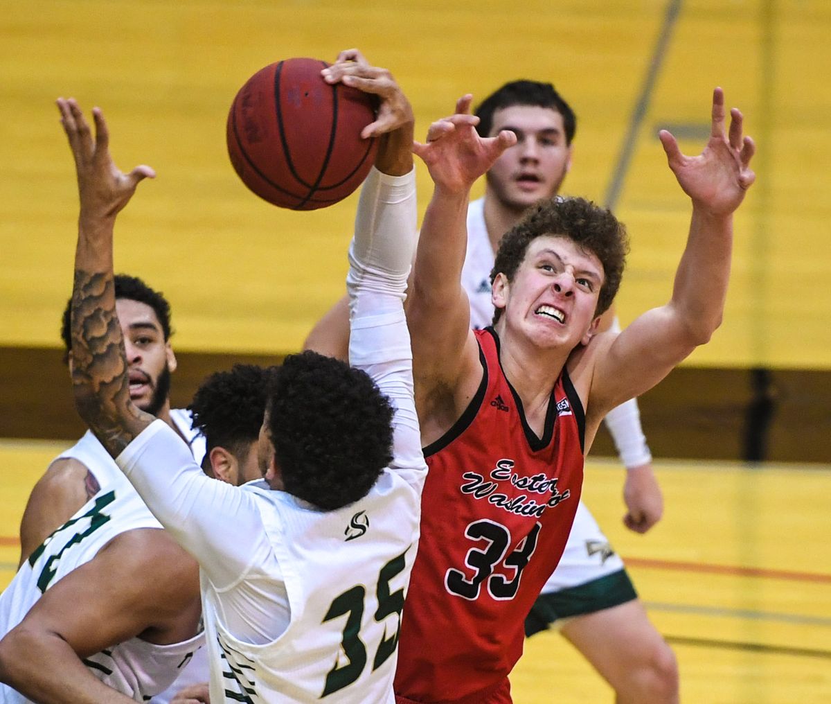 Eastern Washington University forward Jacob Groves battles Sacramento State guard Christian Terrell for a rebound Monday at Reese Court in Cheney. Groves, a sophomore, scored 11 pointsd in the Eagles’ victory.  (DAN PELLE/THE SPOKESMAN-REVIEW)