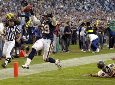 
Donnie Edwards, left, and the Chargers fans are pumped up at being back in the playoffs for first time in several years. 
 (Associated Press / The Spokesman-Review)