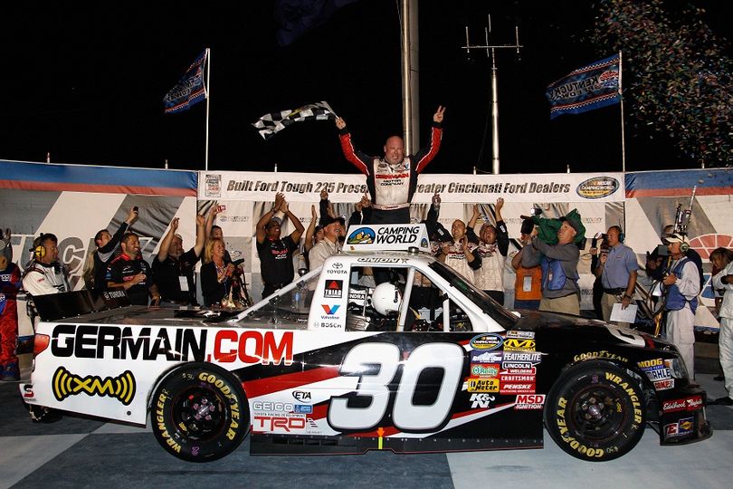 Todd Bodine, driver of the #30 Germain.com Toyota, celebrates after winning the NASCAR Camping World Truck Series Built Ford Tough 225 at Kentucky Speedway. (Photo courtesy of Chris Graythen/Getty Images for NASCAR) (Chris Graythen / Getty Images North America)