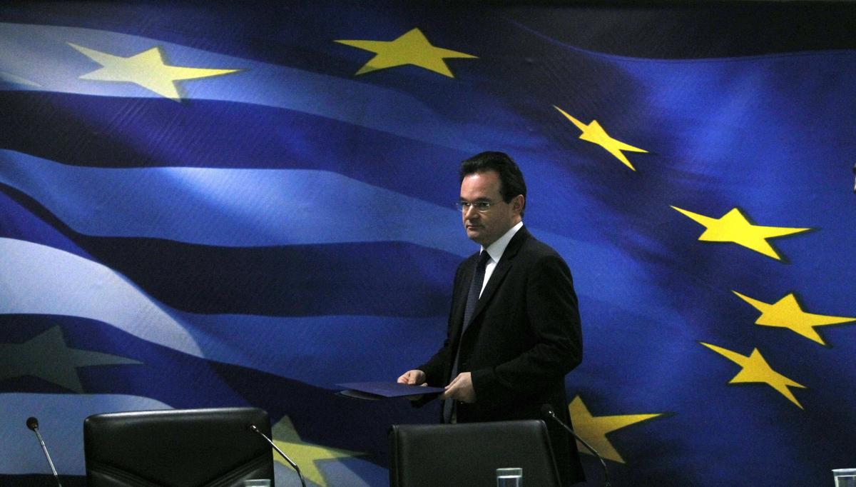 Greece’s Finance Minister George Papaconstantinou addresses the media during a press conference in Athens on Tuesday. Greece took further steps Tuesday to calm global markets spooked by its debt crisis. Associated Press photos (Associated Press photos)