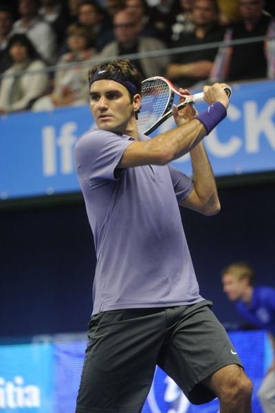 Roger Federer is tied for fourth in singles victories during Open Era. (Associated Press)