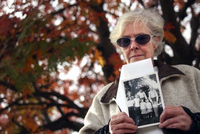
Cilla Sears, 57, holds up a family photograph taken when she was 12.  Several months ago, Sears discovered thirty boxes filled with old photos, letters and other memorabilia were stolen. 
 (Liz Kishimoto / The Spokesman-Review)
