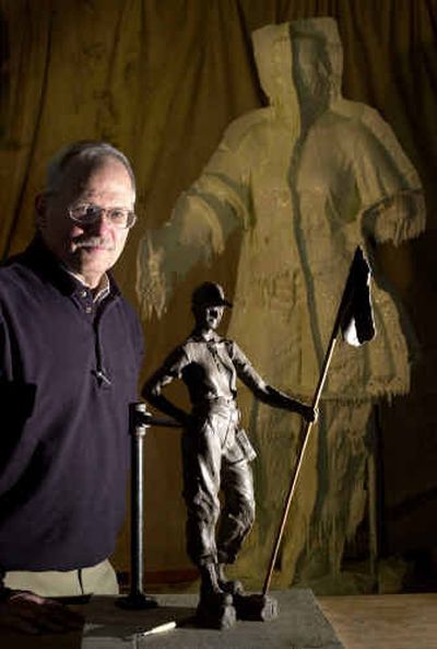 
 Designer and sculptor Joe Mullins stands next to his model.
 (Associated Press / The Spokesman-Review)