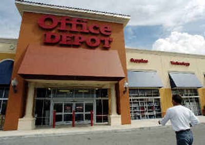
A customer walks towards an Office Depot store in Miami on Wednesday. Office Depot Inc. said Wednesday that third-quarter earnings fell nearly 2 percent as back-to-school and European sales were weaker than expected.  
 (Associated Press / The Spokesman-Review)