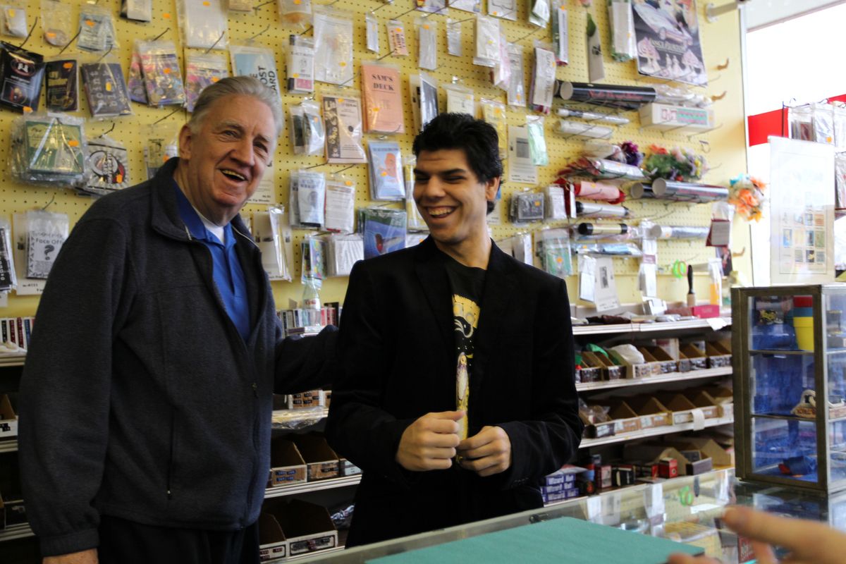 Developmentally disabled magician Trent Rivas, right, laughs with his boss, PJ Johnson, while working at PJ’s Trick Shop in Arlington Heights, Ill.