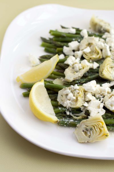 Artichoke and asparagus salad pairs wonderfully with lamb, but will work equally well with goose or ham. (Associated Press)