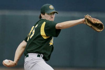 
Oakland pitcher Barry Zito went from his shortest outing ever on opening day to shutting out Seattle his next start. 
 (Associated Press / The Spokesman-Review)