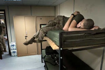 Life on the sidelines: Disappointment and boredom settle in after Shipp and his platoon learn they will be headed back to the USS Germantown instead of moving north and marching into Iraq.
(The Spokesman-Review)