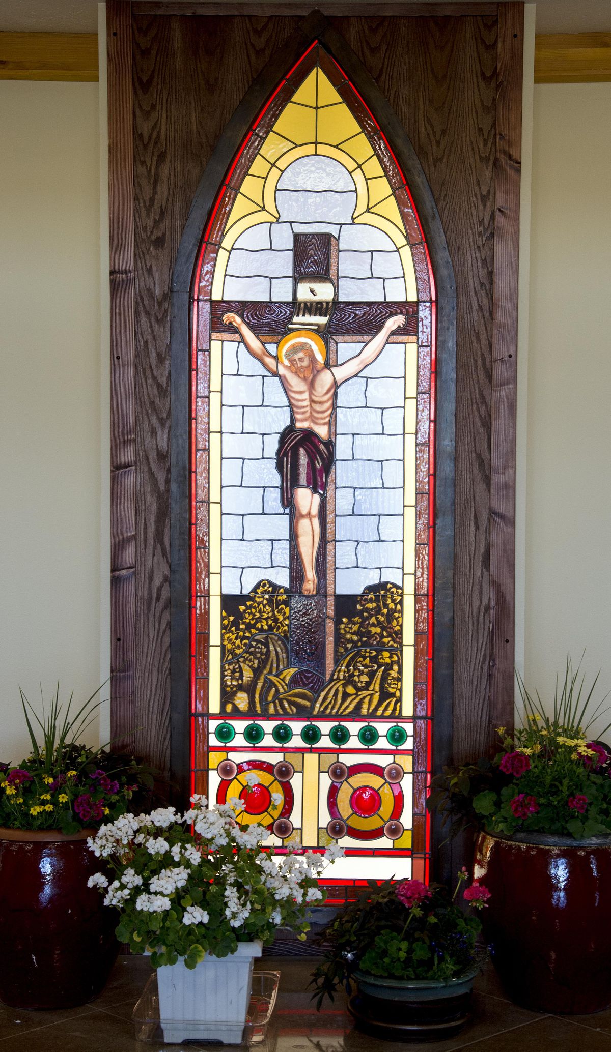 This  stained-glass window depicting the Crucifixion was donated to Our Lady of the Lake Catholic Church by Spokane artist Anthony Boccaccio, who salvaged it from a closed Catholic church in Chittenango, N.Y.  in 1973. The window’s 43-year journey to the small church in Suncrest is filled with coincidence and mystery. (Colin Mulvany / The Spokesman-Review)