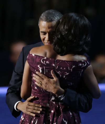 President Barack Obama hugs his wife First lady Michelle Obama at the Democratic National Convention in Charlotte, N.C., on Thursday, Sept. 6, 2012. (Lynne Sladky / Associated Press)