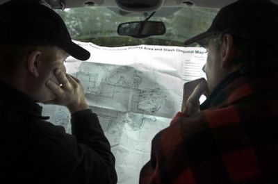 
Russell Vaagen of Vaagen Bros. Lumber and Tim Coleman of Conservation Northwest find their way last week with the help of a map of the Burnt Valley Stewardship Project in the Colville National Forest.  
 (Holly Pickett / The Spokesman-Review)