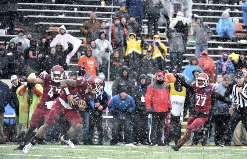 Washington State's Shalom Luani intercepts a trick play pass thrown by Miami running back Joe Yearby with 2:58 remaining in the fourth quarter of the 2015 Hyundai Sun Bowl on Saturday, Dec 26, 2015, at Sun Bowl Stadium in El Paso, TX. (Tyler Tjomsland / The Spokesman-Review)